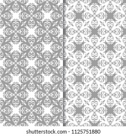 White and gray floral backgrounds. Set of seamless patterns for textile and wallpapers