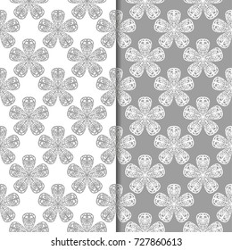 White and gray floral backgrounds. Set of seamless patterns for textile and wallpapers