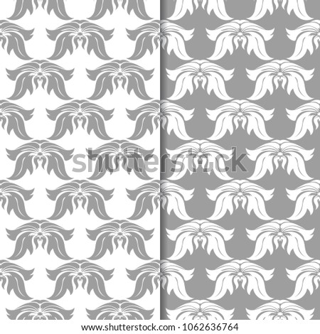 White and gray floral backgrounds. Set of seamless patterns for textile and wallpapers