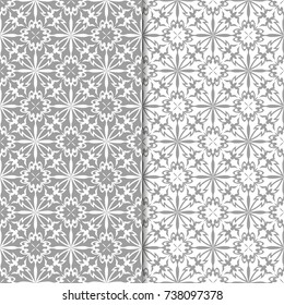White and gray floral ornaments. Set of seamless backgrounds for textile and wallpapers