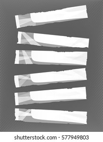 White, gray horizontal paper banners stuck on striped wall