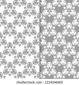 White and gray set of floral backgrounds. Seamless patterns for textile and wallpapers