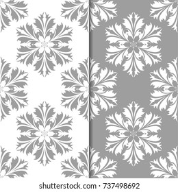 White and gray set of floral backgrounds. Seamless patterns for textile and wallpapers