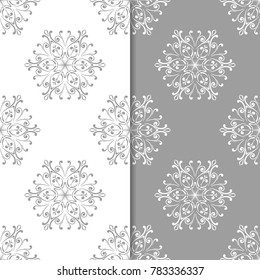 White and gray set of floral backgrounds. Seamless patterns for textile and wallpapers
