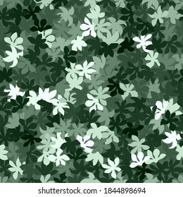 White and green halftone leaves silhouettes on the pastel green background. Green mint decorative style clothing masking camo repeat print. Light green colors winter forest texture