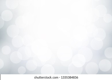 White and grey bokeh effect, Winter blurred background, Abstract snowy concept backdrop.