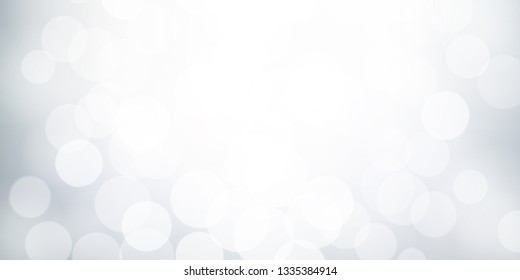 White and grey bokeh effect, Winter blurred background, Abstract snowy concept backdrop.