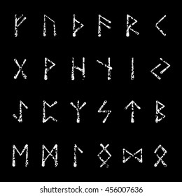 White grunge runic alphabet isolated on black background