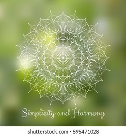 White hand drawn mandala design element on blurred spring grass background.  Yoga motivational poster. Beautiful floral background for resort and spa.  Indian decorative element. Inspiration quote