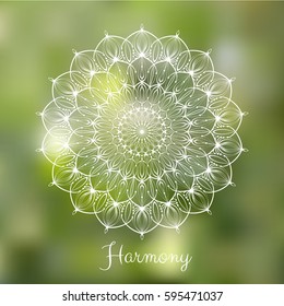 White hand drawn mandala design element on blurred spring grass background.  Yoga motivational poster. Beautiful floral background for resort and spa.  Indian decorative element. Inspiration quote