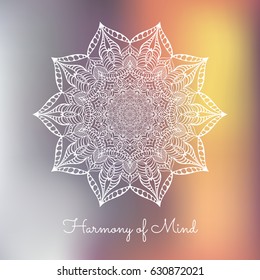 White hand drawn mandala design element on blurred background. 