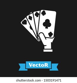 White Hand holding playing cards icon isolated on black background. Casino game design.  Vector Illustration