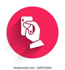 White Hand holding playing cards icon isolated with long shadow. Casino game design. Red circle button. Vector Illustration