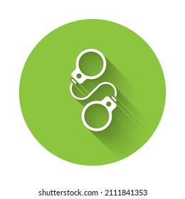 White Handcuffs icon isolated with long shadow. Green circle button. Vector