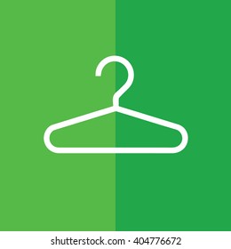 White hanger vector icon. Green background