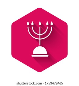 White Hanukkah menorah icon isolated with long shadow. Hanukkah traditional symbol. Holiday religion, jewish festival of Lights. Pink hexagon button. Vector Illustration