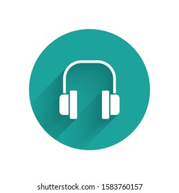White Headphones icon isolated with long shadow. Earphones. Concept for listening to music, service, communication and operator. Green circle button. Vector Illustration