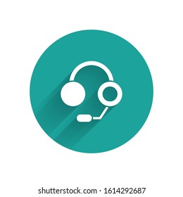 White Headphones icon isolated with long shadow. Earphones. Concept for listening to music, service, communication and operator. Green circle button. Vector Illustration