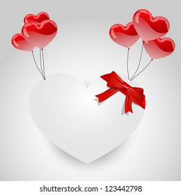 White heart floating with red hearth shaped balloons on a white background.