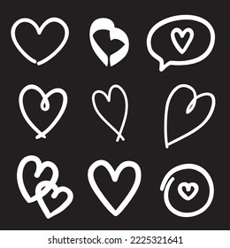 White heart on isolated black background. Outlined objects on a blackboard. Hand drawn hearts for banner, flyer or poster. Elements on a chalkboard. Black and white illustration