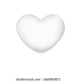 White heart pillow with soft shadow.