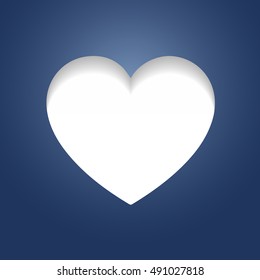 White heart shape cut out of deep blue paper surface.