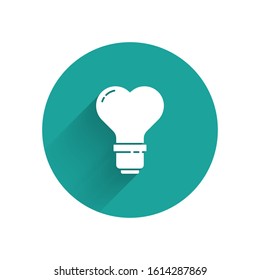 White Heart shape in a light bulb icon isolated with long shadow. Love symbol. Valentine day symbol. Green circle button. Vector Illustration