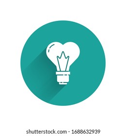 White Heart shape in a light bulb icon isolated with long shadow. Love symbol. 8 March. International Happy Women Day. Green circle button. Vector Illustration