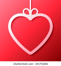 White heart shaped frame on red background