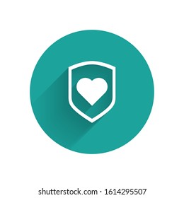 White Heart with shield icon isolated with long shadow. Love symbol. Security, safety, protection, protect concept. Valentines day. Green circle button. Vector Illustration