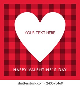 White heart with text on the red checkered background