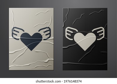 White Heart with wings icon isolated on crumpled paper background. Love symbol. Valentines day. Paper art style. Vector