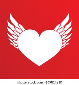 White heart with wings on the red background