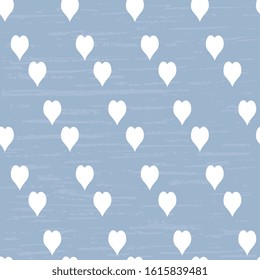 
White hearts on a blue background, artistic, textured. Fabric design. Retro background or pattern.