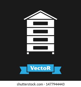 White Hive for bees icon isolated on black background. Beehive symbol. Apiary and beekeeping. Sweet natural food.  Vector Illustration