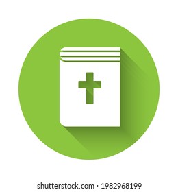 White Holy bible book icon isolated with long shadow. Green circle button. Vector