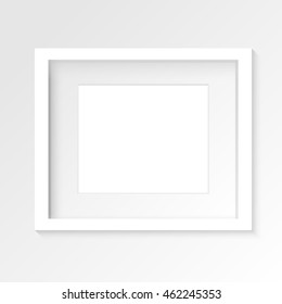 White horizontal photo frame on gray wall with realistic shadows. Vector illustration. EPS10.