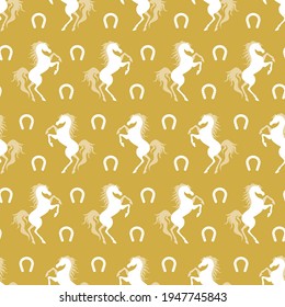White horse and horseshoe silhouette on yellow background seamless pattern. Vector illustration.