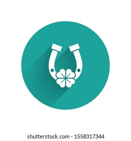 White Horseshoe with four leaf clover icon isolated with long shadow. Happy Saint Patricks day. Green circle button. Vector Illustration