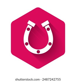 White Horseshoe icon isolated with long shadow. Pink hexagon button. Vector