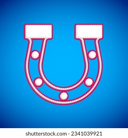 White Horseshoe icon isolated on blue background.  Vector
