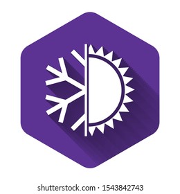 White Hot and cold symbol. Sun and snowflake icon isolated with long shadow. Winter and summer symbol. Purple hexagon button. Vector Illustration