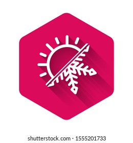 White Hot and cold symbol. Sun and snowflake icon isolated with long shadow. Winter and summer symbol. Pink hexagon button. Vector Illustration