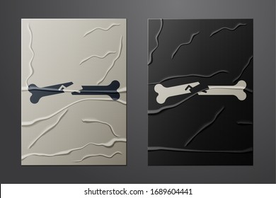 White Human broken bone icon isolated on crumpled paper background. Paper art style. Vector Illustration