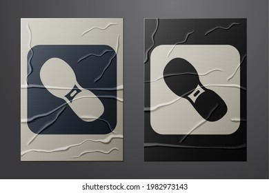 White Human footprints shoes icon isolated on crumpled paper background. Shoes sole. Paper art style. Vector