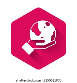 White Human hand holding Earth globe icon isolated with long shadow background. Save earth concept. Pink hexagon button. Vector