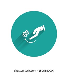 White Human hand throwing game dice icon isolated with long shadow. Green circle button. Vector Illustration