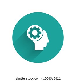 White Human head with gear inside icon isolated with long shadow. Artificial intelligence. Thinking brain sign. Symbol work of brain. Green circle button. Vector Illustration