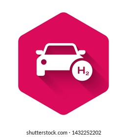 White Hydrogen car icon isolated with long shadow. H2 station sign. Hydrogen fuel cell car eco environment friendly zero emission. Pink hexagon button. Vector Illustration