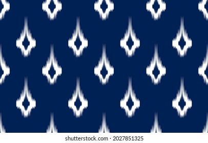 white ikat ethnic design blue background. Seamless rhombus ikat pattern in tribal, folk embroidery abstract damask art. ornament print. Design for carpet, clothing, wrapping, fabric, fashion.